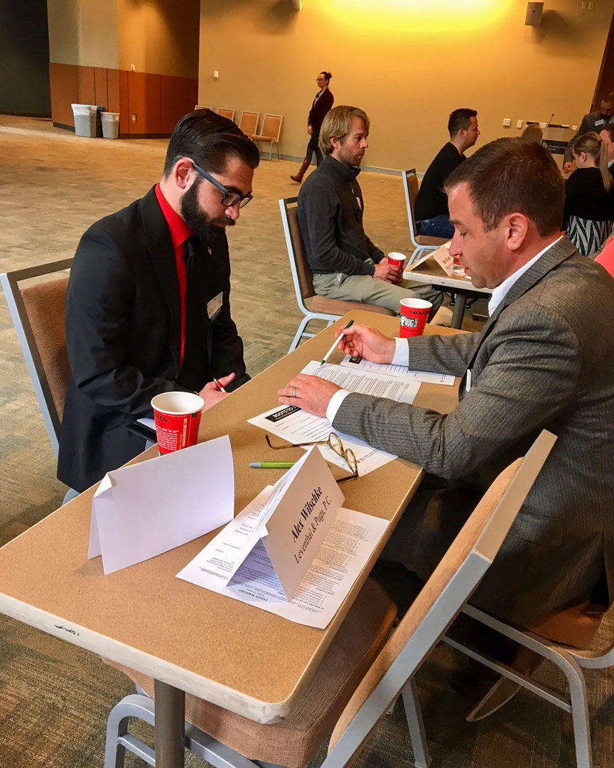 A participant in a mock interview with a volunteer attorney