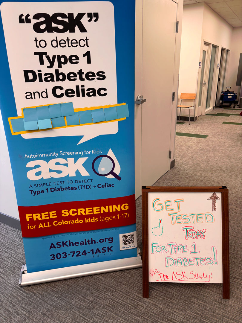 ASK free Type 1 diabetes and celiac screening banner at a clinic hallway